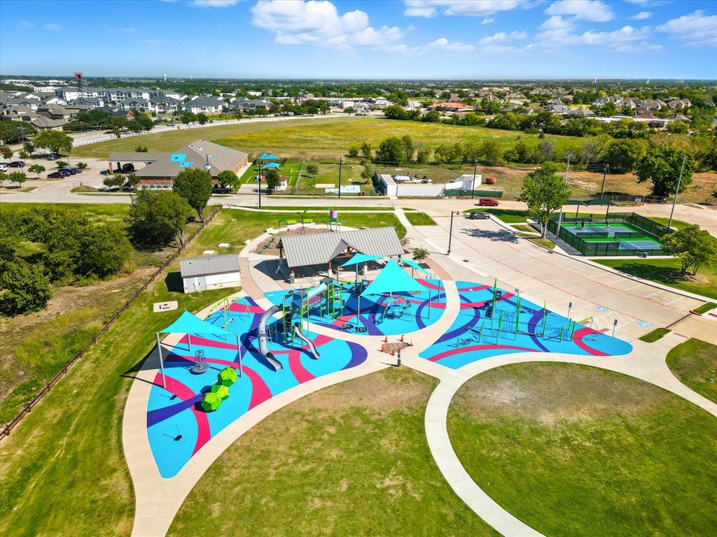 4125 Caprock Canyon Road Sachse, TX 75048 - Photo 37 of 40 an aerial view of a swimming pool with a city view