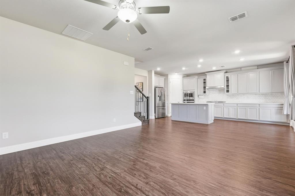 4125 Caprock Canyon Road Sachse, TX 75048 - Photo 10 of 40 a view of kitchen with wooden floor and window