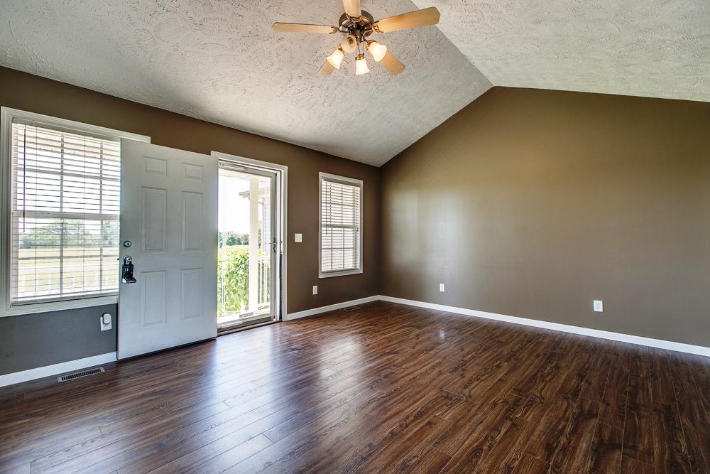 1115 County Line Road Bell Buckle, TN 37020 - Photo 3 of 14 an empty room with wooden floor and windows