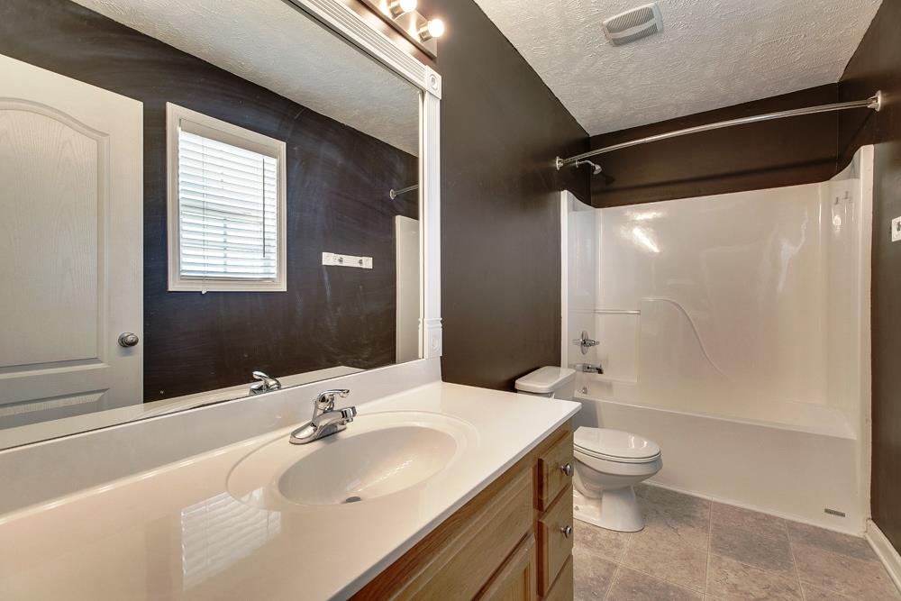 1115 County Line Road Bell Buckle, TN 37020 - Photo 8 of 14 a bathroom with a sink toilet and shower