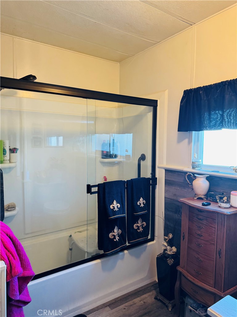 13393 Mariposa Road, Unit 281 Victorville, CA 92395 - Photo 15 of 16 a living room with a dresser and a couch