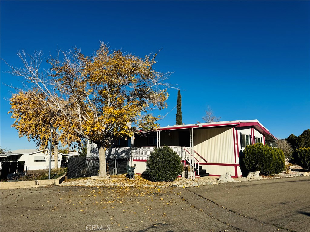 13393 Mariposa Road, Unit 281 Victorville, CA 92395 - Photo 2 of 16 a street view with tall buildings and a street