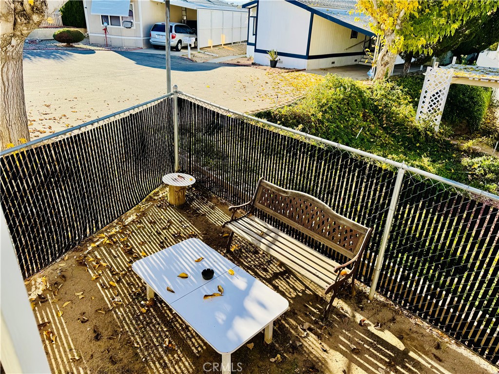 13393 Mariposa Road, Unit 281 Victorville, CA 92395 - Photo 3 of 16 a view of a patio with iron fence