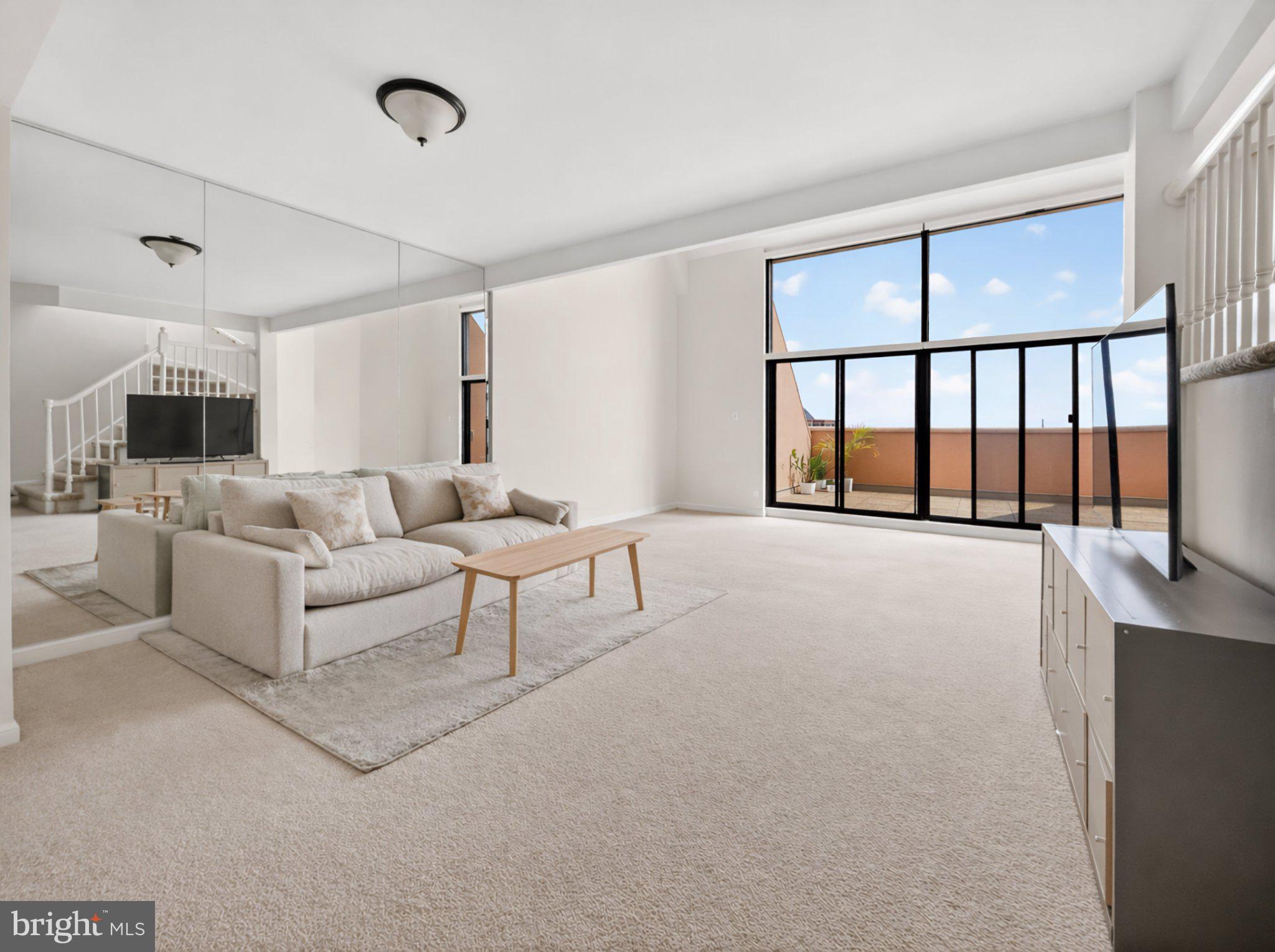1301 North Courthouse Road, Unit 1803 Arlington, VA 22201 - Photo 12 of 33 Spacious, sunlit living area awaits you.