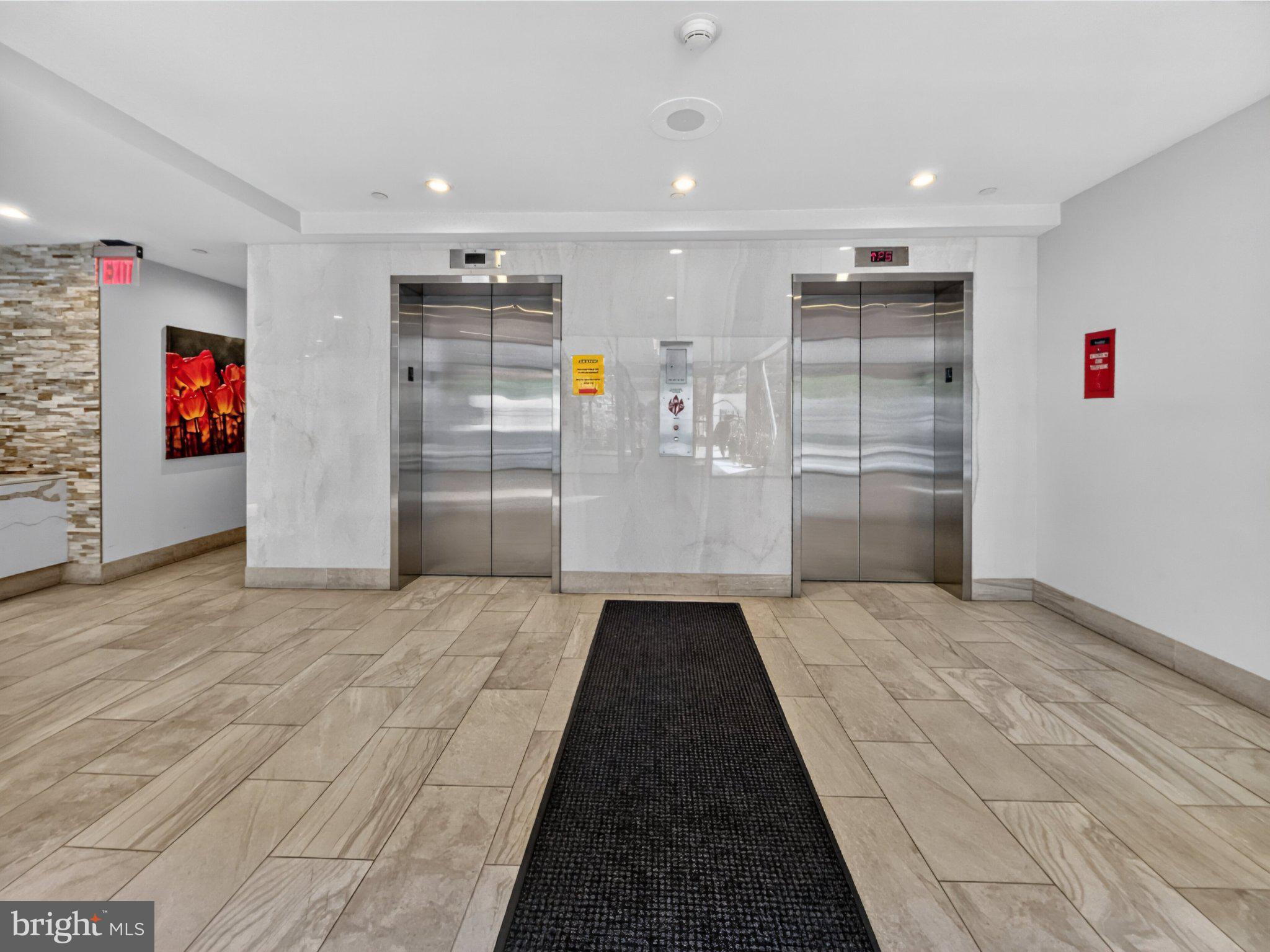 1301 North Courthouse Road, Unit 1803 Arlington, VA 22201 - Photo 25 of 33 Modern lobby with sleek elevators.