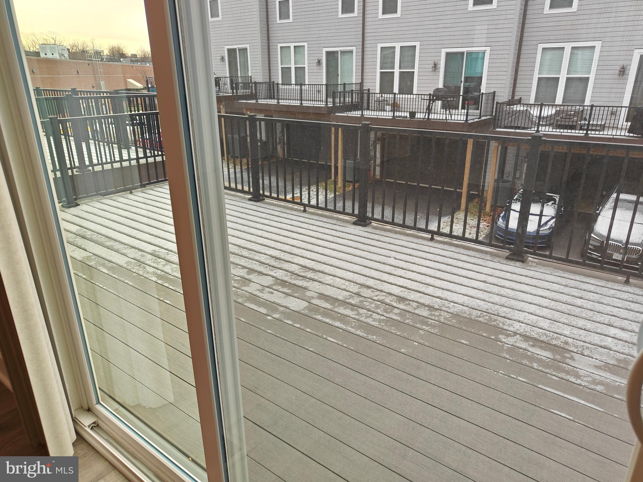 2393 Liberty Loop Herndon, VA 20171 - Photo 17 of 45 a view of a balcony with wooden floor