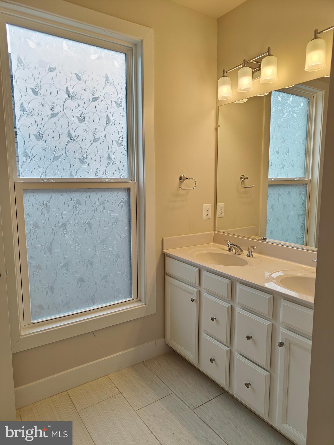 2393 Liberty Loop Herndon, VA 20171 - Photo 24 of 45 a bathroom with a granite countertop sink mirror and a