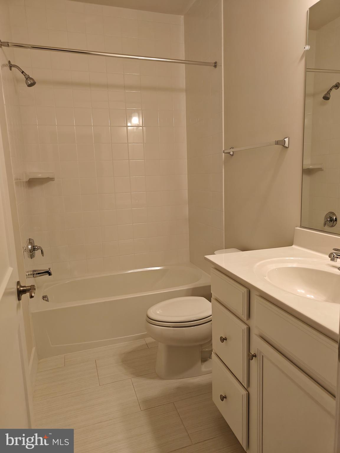 2393 Liberty Loop Herndon, VA 20171 - Photo 29 of 45 a bathroom with a granite countertop sink toilet and shower
