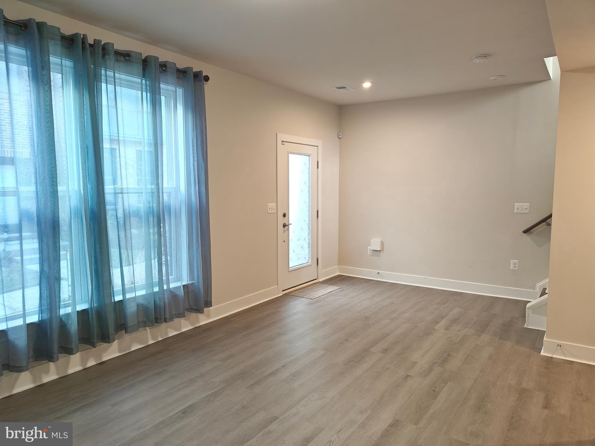 2393 Liberty Loop Herndon, VA 20171 - Photo 34 of 45 an empty room with wooden floor and windows