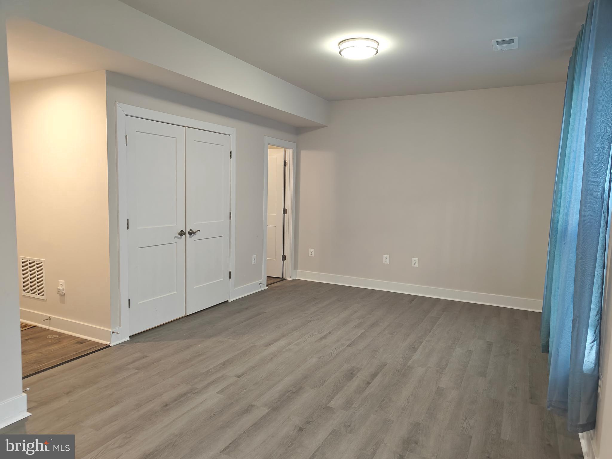 2393 Liberty Loop Herndon, VA 20171 - Photo 36 of 45 a view of an empty room with wooden floor