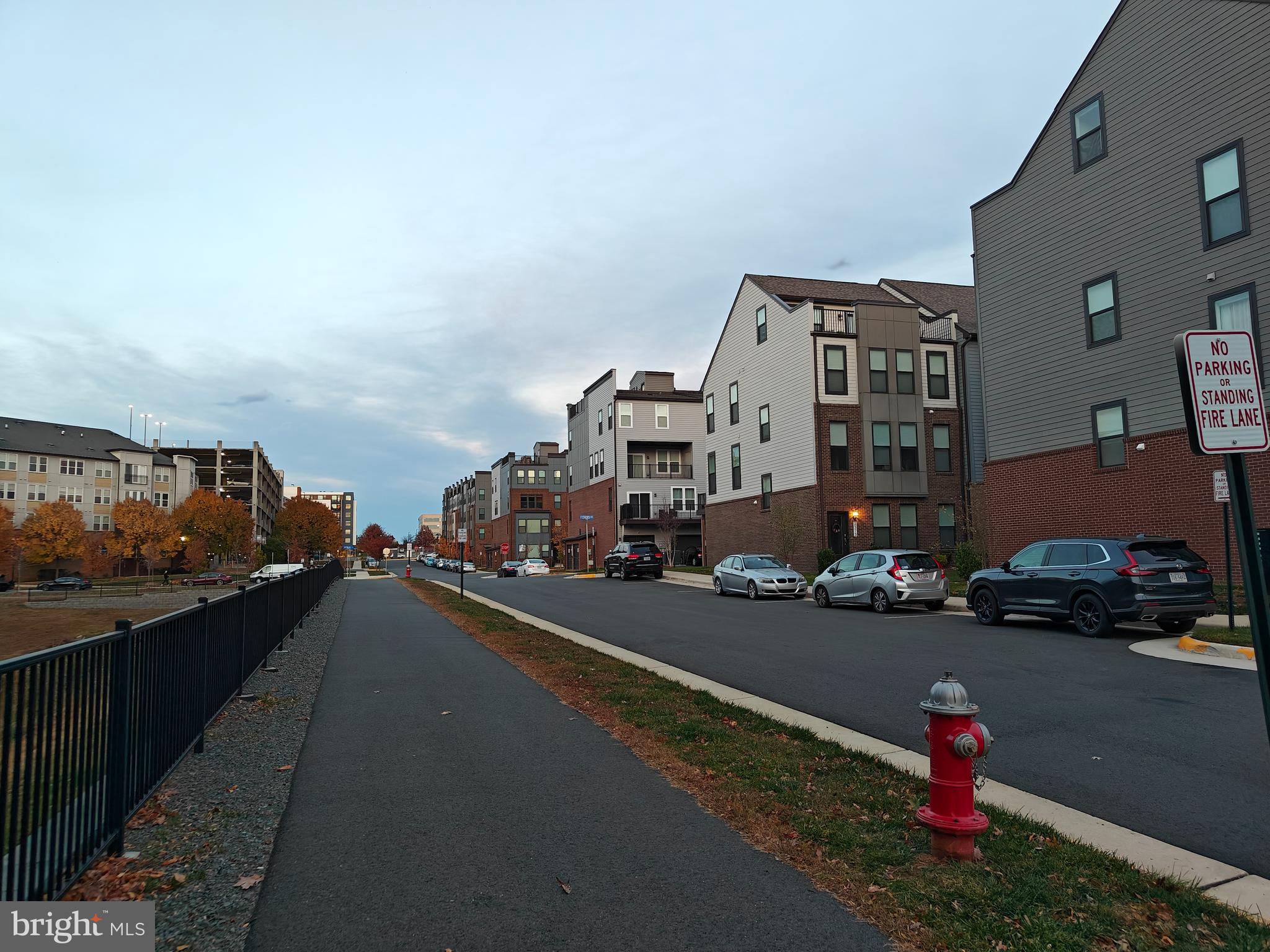 2393 Liberty Loop Herndon, VA 20171 - Photo 40 of 45 a city street lined with buildings and cars