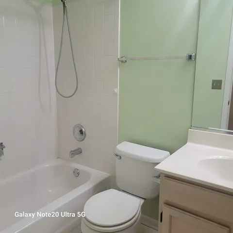 a bathroom with a sink a toilet and a bathtub