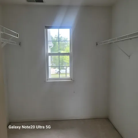 a view of a room that has a window in it