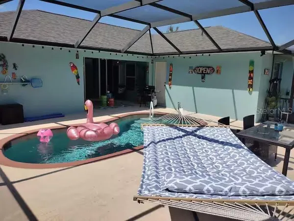 a view of a swimming pool with a patio