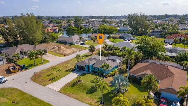 an aerial view of residential houses with outdoor space