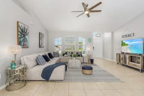 a living room with furniture and a table