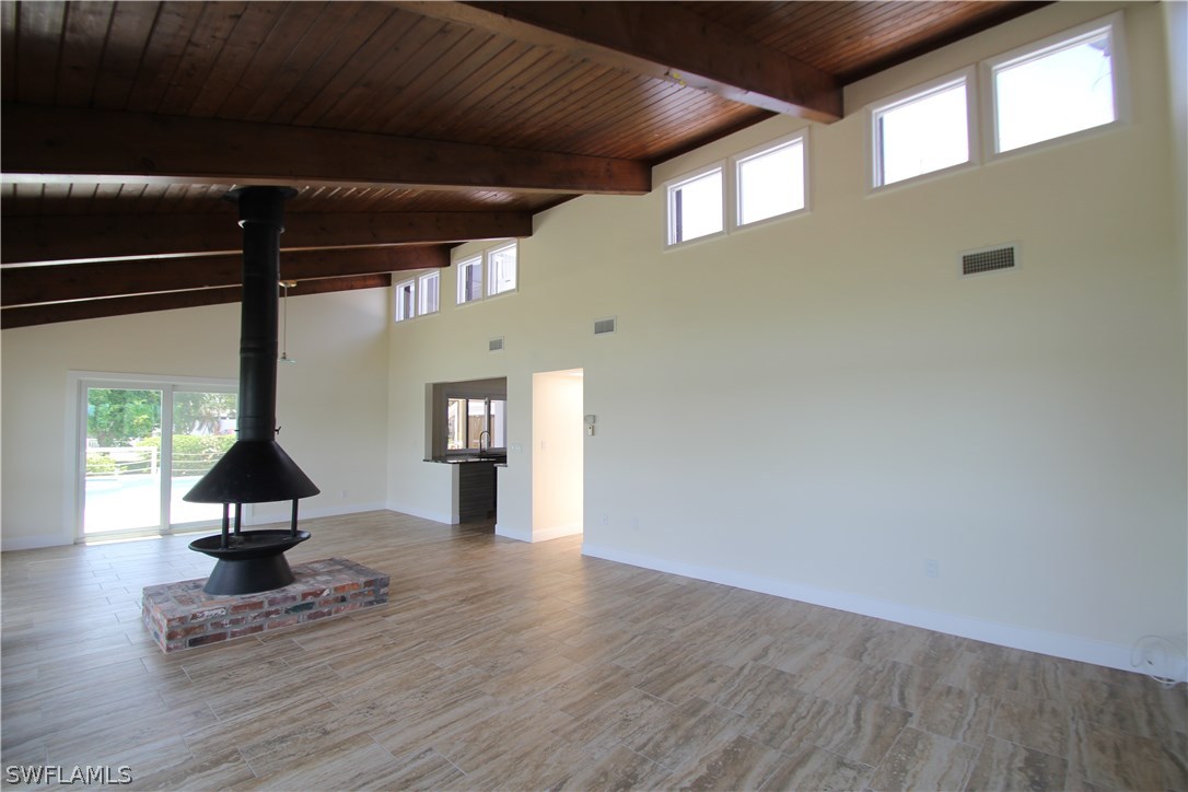 21521 Madera Road Fort Myers Beach, FL 33931 - Photo 14 of 24 a view of a hallway with wooden floor