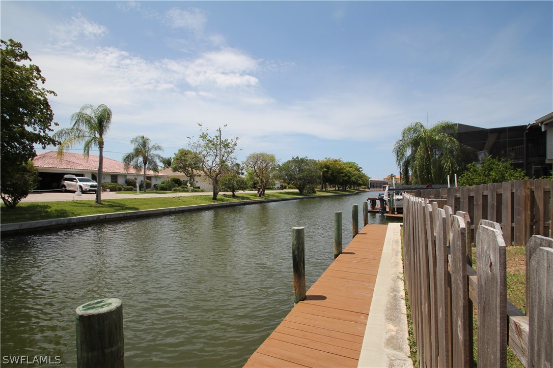 21521 Madera Road Fort Myers Beach, FL 33931 - Photo 5 of 24 a view of a lake with a large bridge