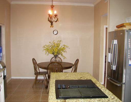 7006 Brandon Drive Corpus Christi, TX 78413 - Photo 3 of 8 a view of a dining room with furniture and a chandelier