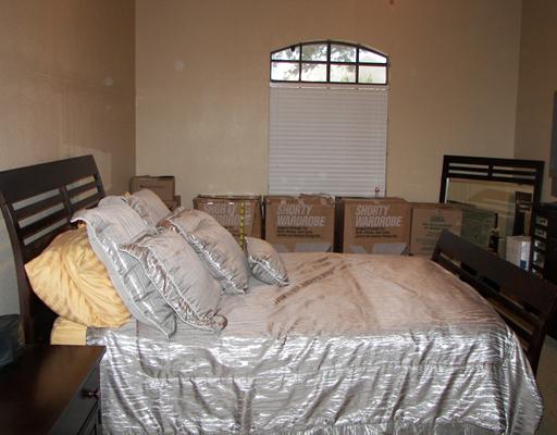 7006 Brandon Drive Corpus Christi, TX 78413 - Photo 5 of 8 a bedroom with a bed and a mirror