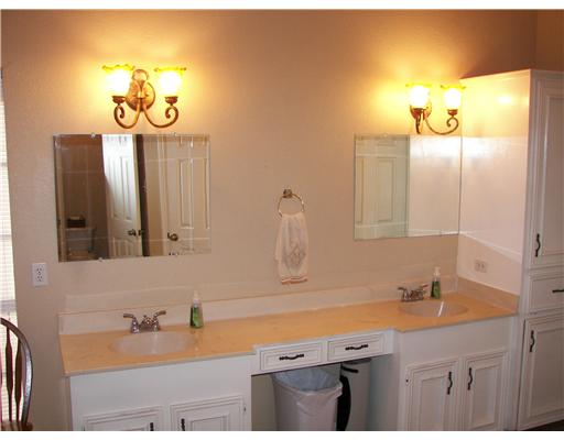 7006 Brandon Drive Corpus Christi, TX 78413 - Photo 6 of 8 a bathroom with a sink and a mirror