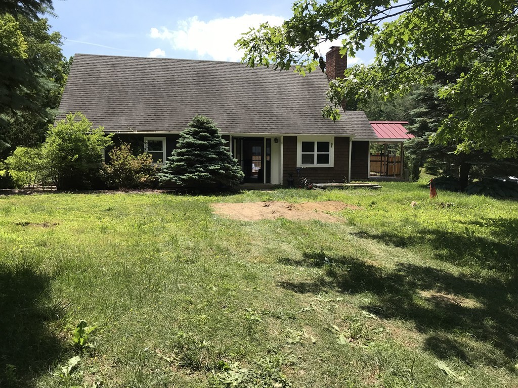 460 Leadmine Road Sturbridge, MA 01566 - Photo 2 of 30 a front view of a house with yard and trees