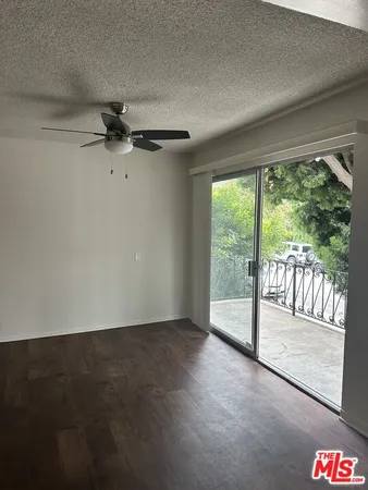 a view of an empty room and a window