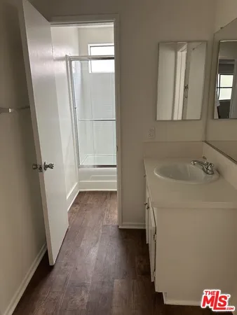 a bathroom with a shower and a window