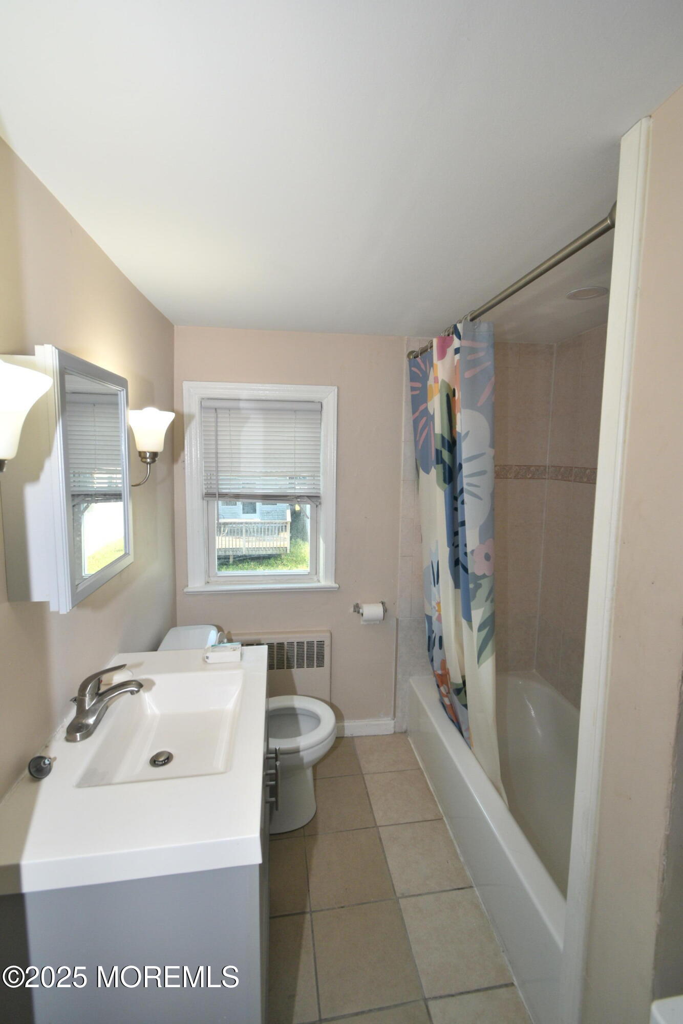 164 Front, Unit 2 Keyport, NJ 07735 - Photo 8 of 11 a bathroom with a sink a toilet and shower