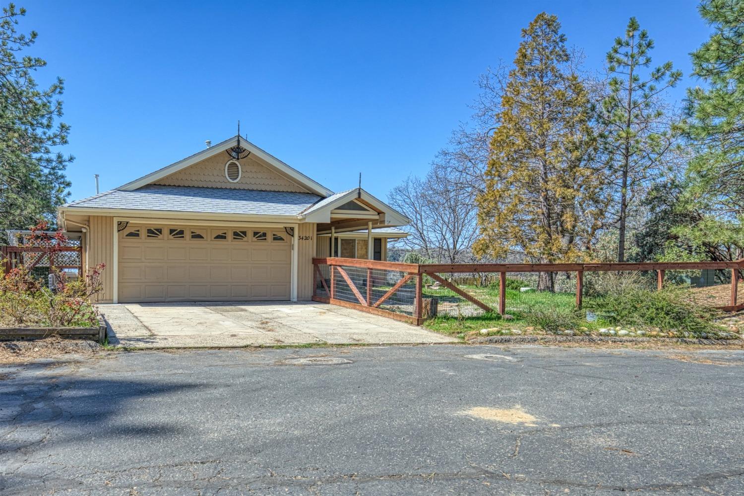 34201 Natoma Road Auberry, CA 93602 - Photo 2 of 40 a front view of a house with a yard