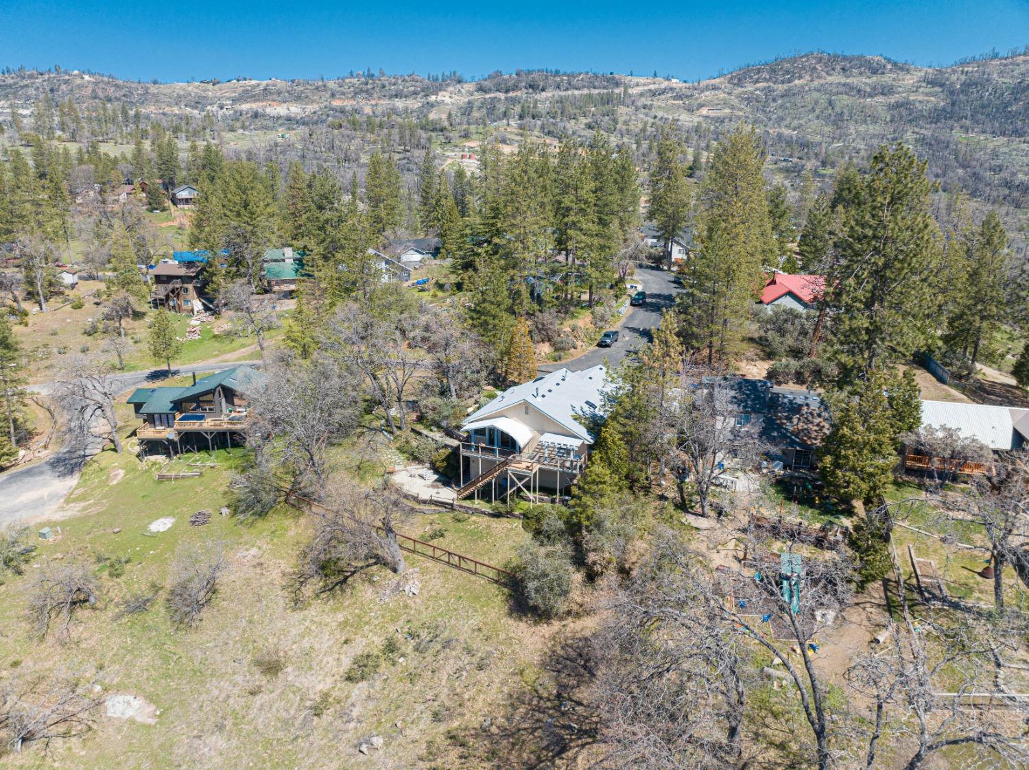 34201 Natoma Road Auberry, CA 93602 - Photo 35 of 40 a view of a forest with a mountain
