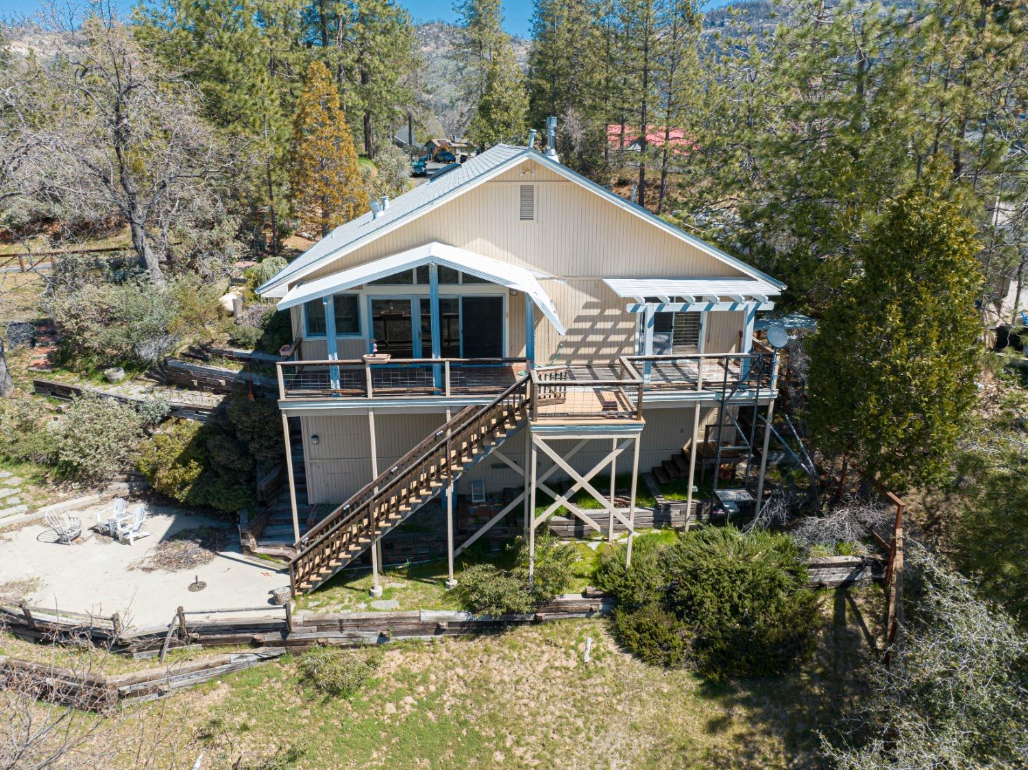 34201 Natoma Road Auberry, CA 93602 - Photo 38 of 40 a house with trees in the background