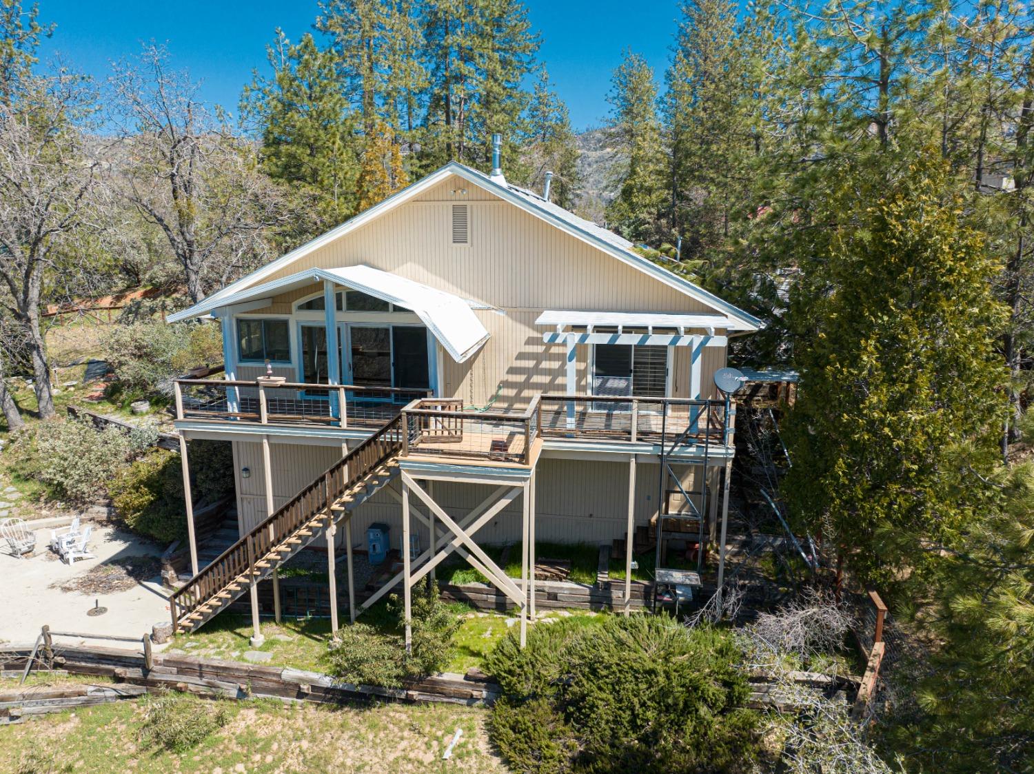 34201 Natoma Road Auberry, CA 93602 - Photo 39 of 40 a roof deck with table and chairs under an umbrella