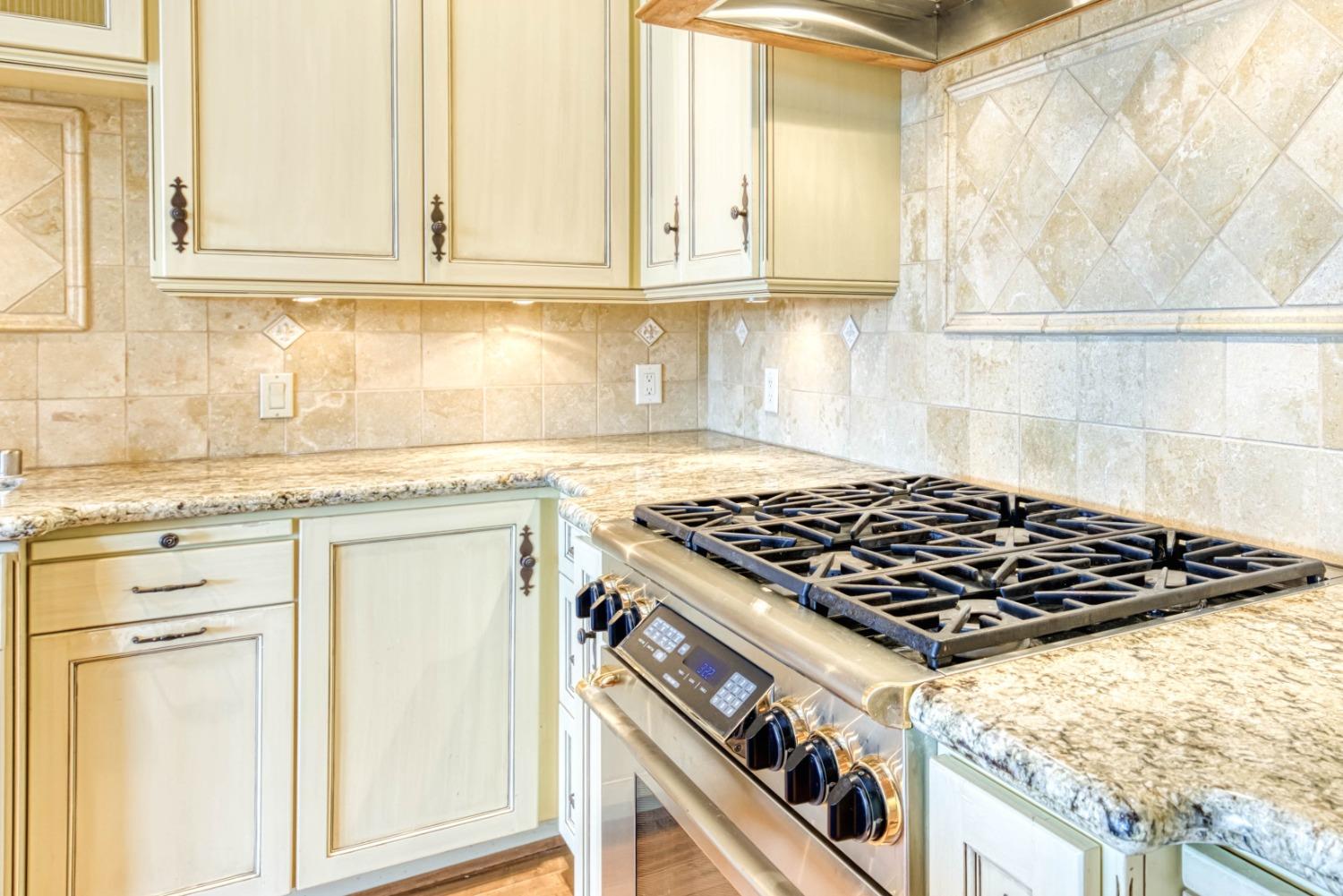34201 Natoma Road Auberry, CA 93602 - Photo 10 of 40 a stove top oven sitting inside of a kitchen