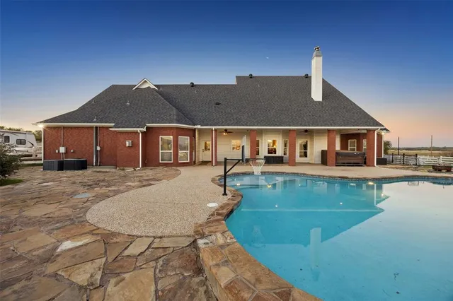 a front view of a house with swimming pool