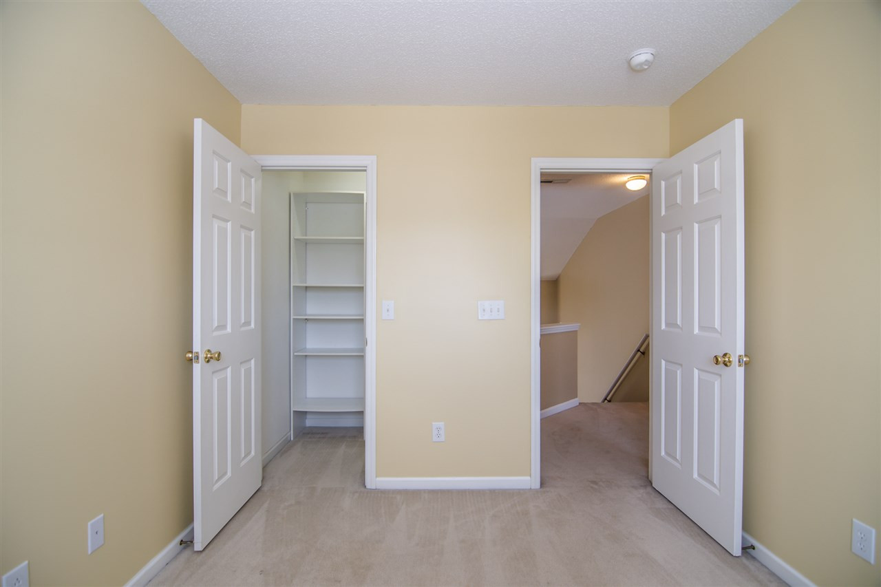 5417 Roan Mountain Place Raleigh, NC 27613 - Photo 16 of 25 Secondary bedroom walk in closet with custom built-in