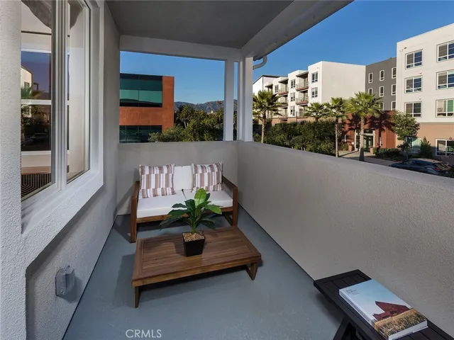 a view of balcony with furniture