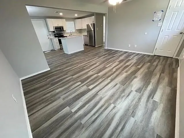 a view of a kitchen with a refrigerator
