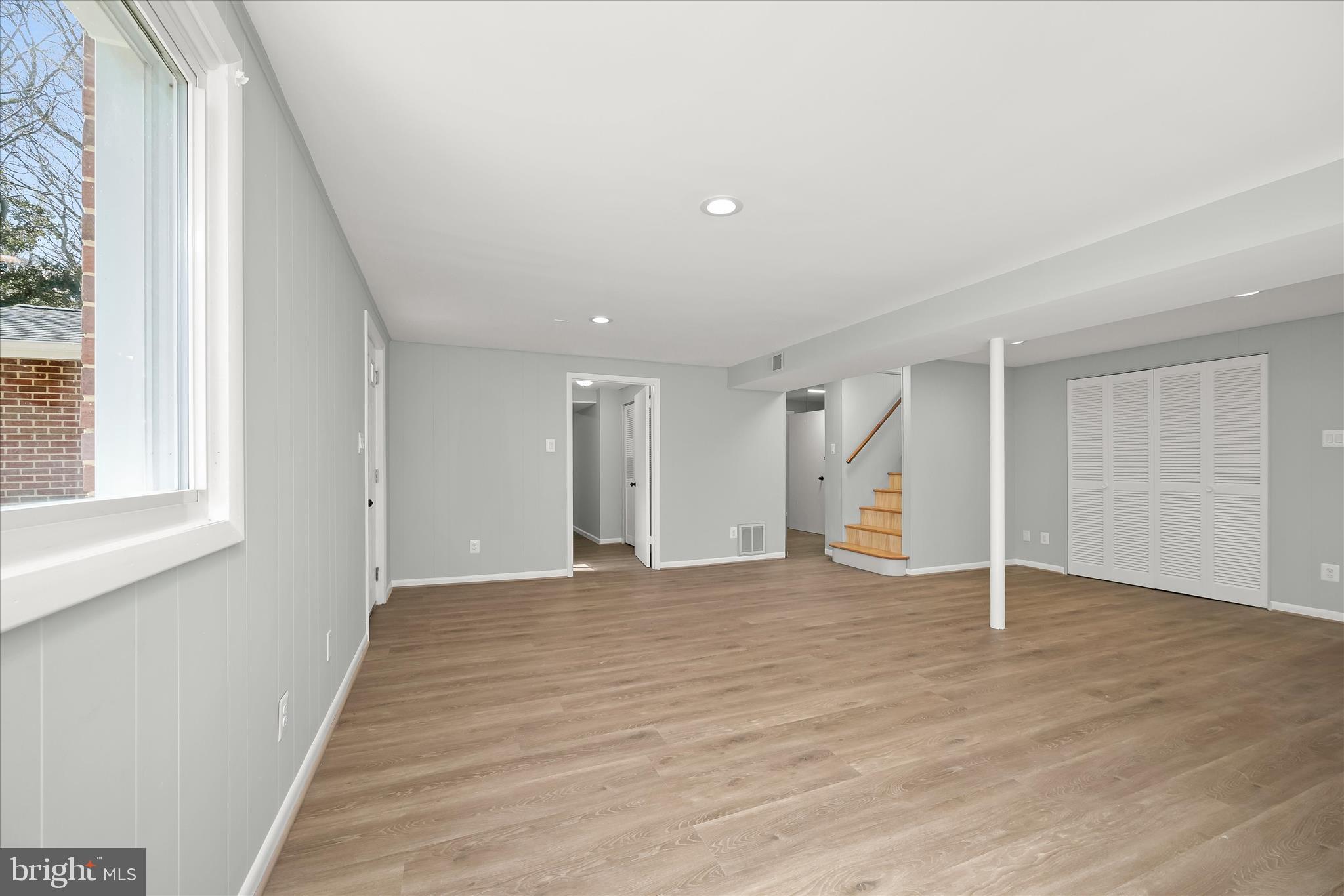 9720 Hedin Drive Silver Spring, MD 20903 - Photo 52 of 79 a view of empty room with wooden floor and fan
