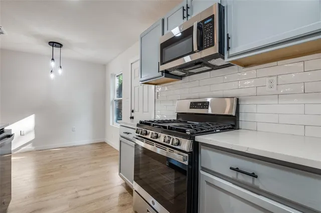 a sink with white cabinets