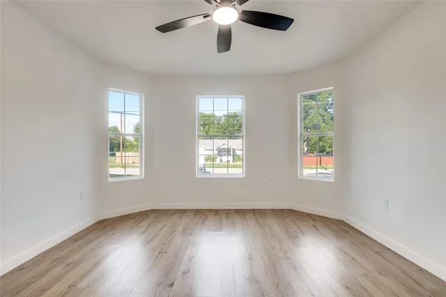 a kitchen with stainless steel appliances a sink a stove and cabinets