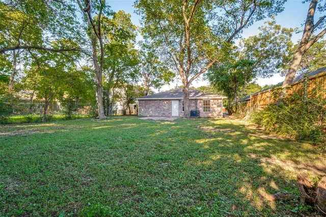 a view of backyard with green space