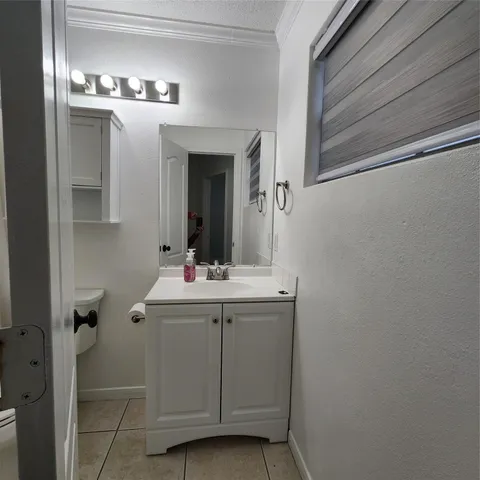 a front view of a house with a yard table and chairs