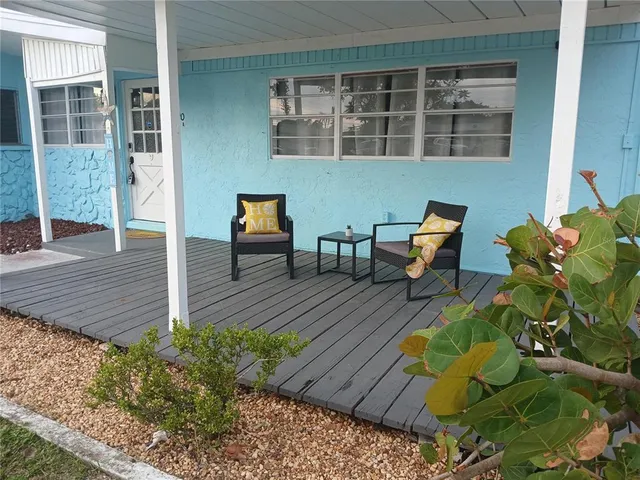 a swimming pool with outdoor seating