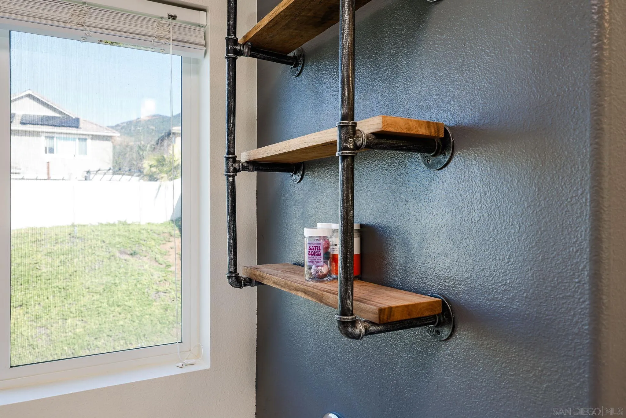 310 Falabella Lane Fallbrook, CA 92028 - Photo 24 of 48 a bedroom with a bed and a window