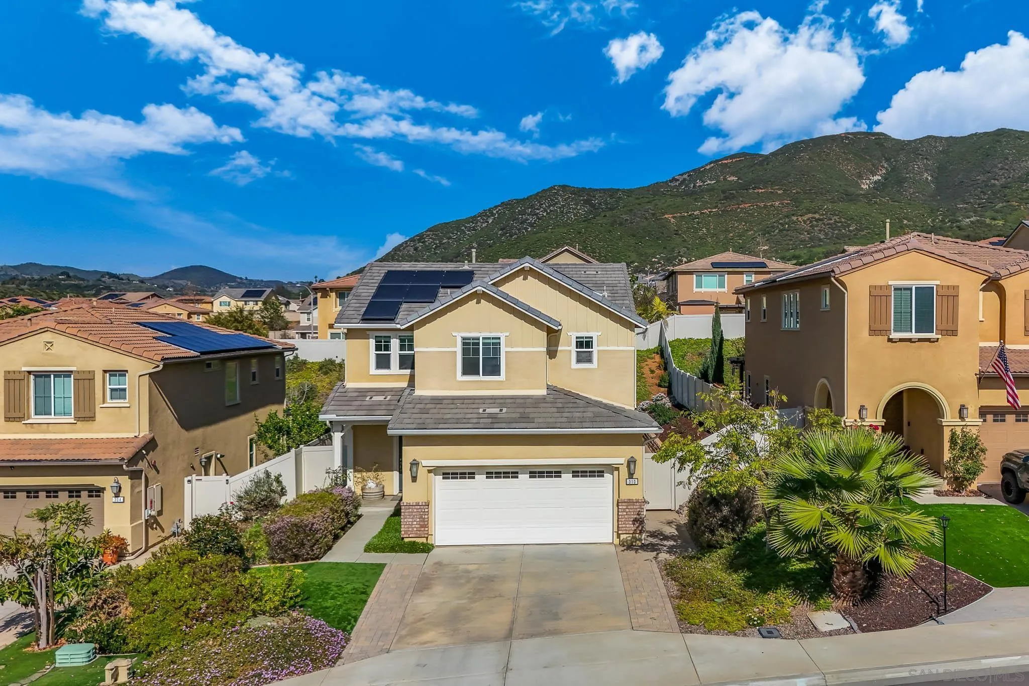 310 Falabella Lane Fallbrook, CA 92028 - Photo 38 of 48 a front view of a house with a garden
