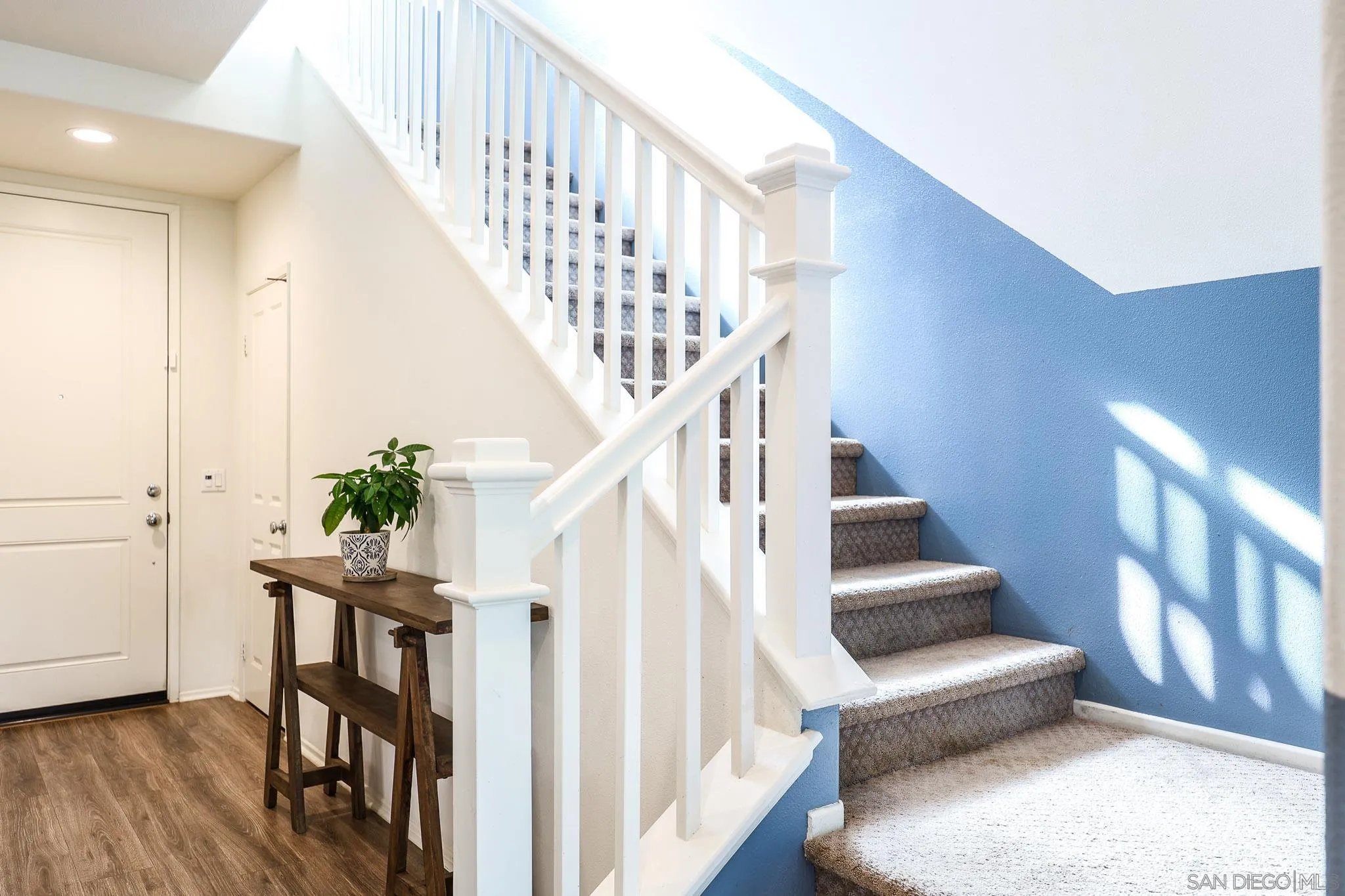 310 Falabella Lane Fallbrook, CA 92028 - Photo 7 of 48 a view of entryway with wooden floor and stairs