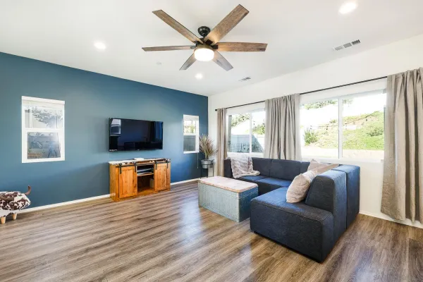 a living room with furniture and a flat screen tv