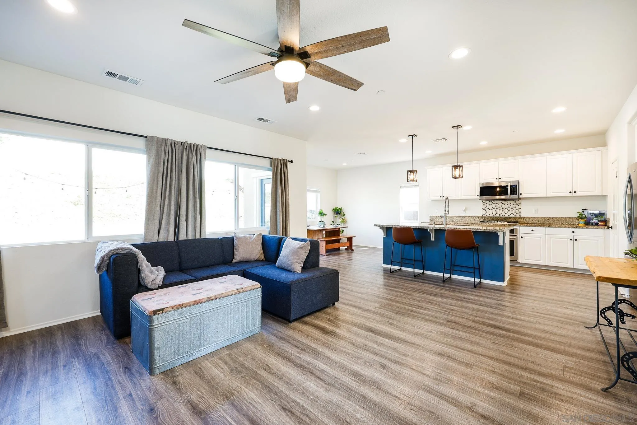 310 Falabella Lane Fallbrook, CA 92028 - Photo 9 of 48 a living room with furniture and kitchen view