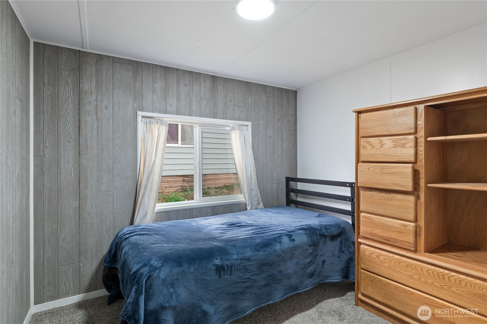 3060 Northeast McWilliams Road, Unit 122 Bremerton, WA 98311 - Photo 13 of 20 a bedroom with a bed and a closet